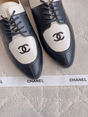CHANEL 25S TWO TONE LACE UP IN BLACK AND WHITE CALFSKIN