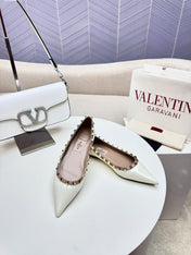 ROCKSTUD FLAT PUMP IN WHITE CALFSKIN