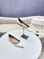 ROCKSTUD FLAT PUMP IN WHITE CALFSKIN
