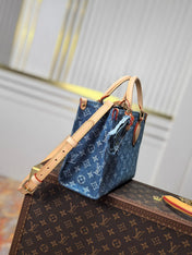 LV 25S ONTHEGO 28 IN BLUE MONOGRAM DENIM COTTON CALFSKIN LEATHER STRAP