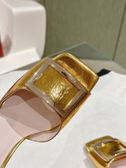 TRUMPET METALLIC MULES IN GOLD PATENT CALFSKIN