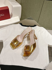 TRUMPET METALLIC MULES IN GOLD PATENT CALFSKIN