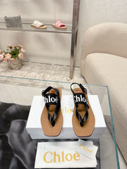 THONG SANDALS IN BLACK CALFSKIN AND CANVAS