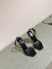 YSL 25S HIGH-HEEL SANDALS 100 MM IN BLACK LAMBSKIN WITH YSL LOGO HEEL DESIGN