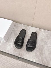 THICK-SOLED SLIDES IN BLACK SMOOTH LAMBSKIN LOGO WITH CRYSTALS