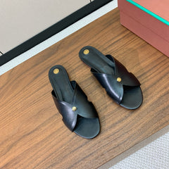 FLAT SLIPPERS IN BLACK CALFSKIN