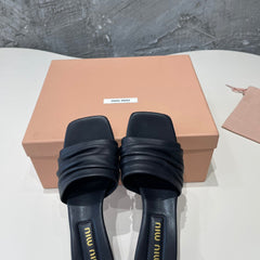 HIGH - HEEL BLACK SHEEPSKIN WITH STYLIZED STRAPS