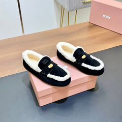 LOAFERS IN BLACK SUEDE AND WHITE SHEARLING TRIM