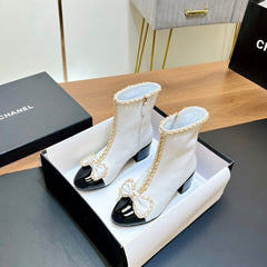 CHANEL 25S HEELED CHAIN BOOTS WITH BOW IN WHITE CALFSKIN GOLD HARDWRE