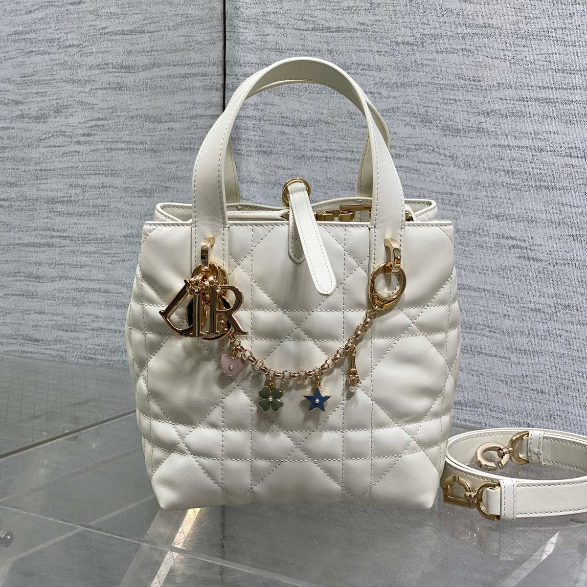 DIOR 25S TOUJOURS VERTICAL TOTE BAG 18 IN IVORY CALFSKIN WITH CHARM BRACELET STRAP