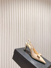 CC HIGH SLINGBACK IN BEIGE LAMBSKIN WITH BOW ATTACHED