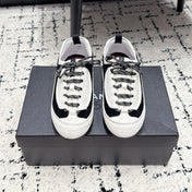 CHANEL 26S LACE-UP SNEAKERS IN WHITE AND BLACK SUEDE STYLE 2
