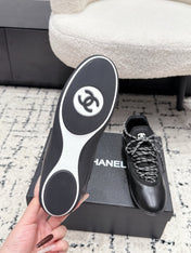 CHANEL 26S LACE-UP SNEAKERS IN BLACK FABRIC AND LAMBSKIN