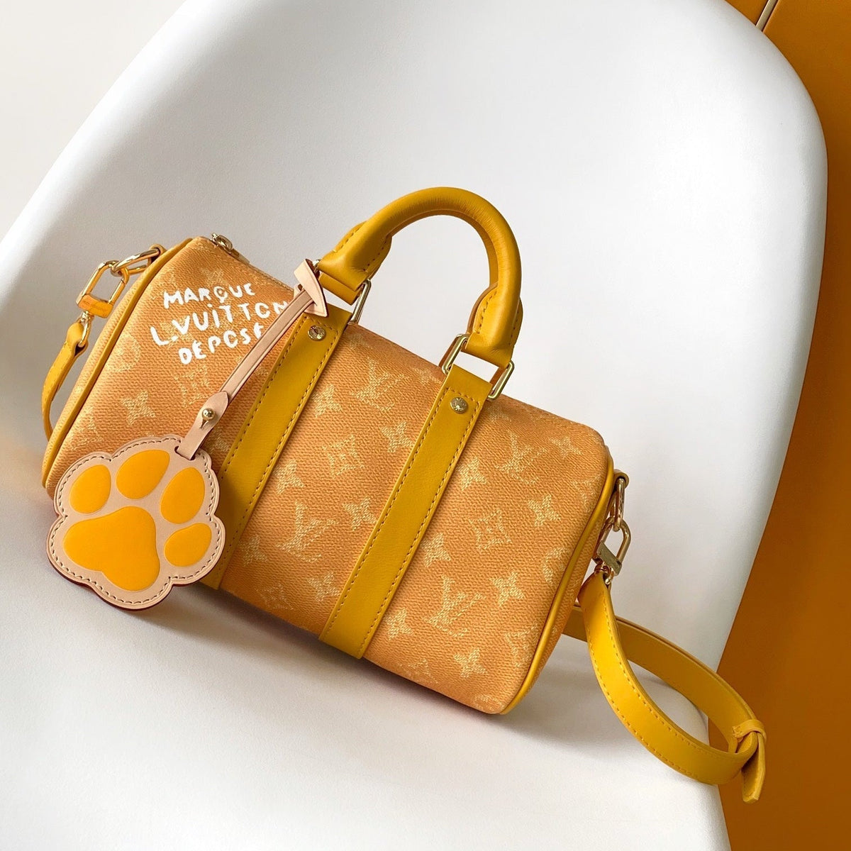 KEEPALL BANDOULIÈRE 25 IN ORANGE MONOGRAM HERITAGE CANVAS