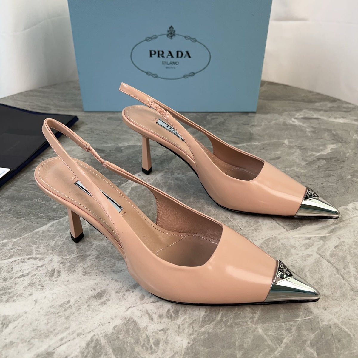 PRADA 25S METAL-TOE SLINGBACK PUMPS IN WARM BEIGE CALFSKIN