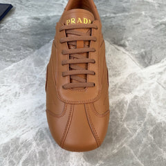 PRADA 25S MONTECARLO ANTIQUED SNEAKERS IN CARAMEL NAPPA LEATHER
