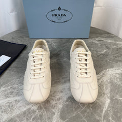 PRADA 25S MONTECARLO ANTIQUED SNEAKERS IN CHALK WHITE NAPPA LEATHER