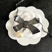 CHANEL 26S DOUBLE C LOGO PINK ENAMEL BOW & PEARL PENDANT NECKLACE IN BLACK METAL 629976