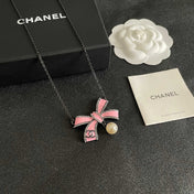 CHANEL 26S DOUBLE C LOGO PINK ENAMEL BOW & PEARL PENDANT NECKLACE IN BLACK METAL 629976