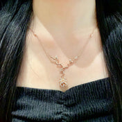 CD 26S CRYSTAL ROSE BRANCH PENDANT NECKLACE IN ROSE GOLD TONE METAL 631896