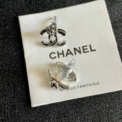 CHANEL 26S DOUBLE C LOGO PEARL STUD EARRINGS WITH FLORAL DETAIL IN SILVER METAL 631916