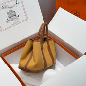 GARDEN PARTY 30CM IN DUNE MAGNOLIA TOILETS COTTON CANVAS AND BROWN CALFSKIN
