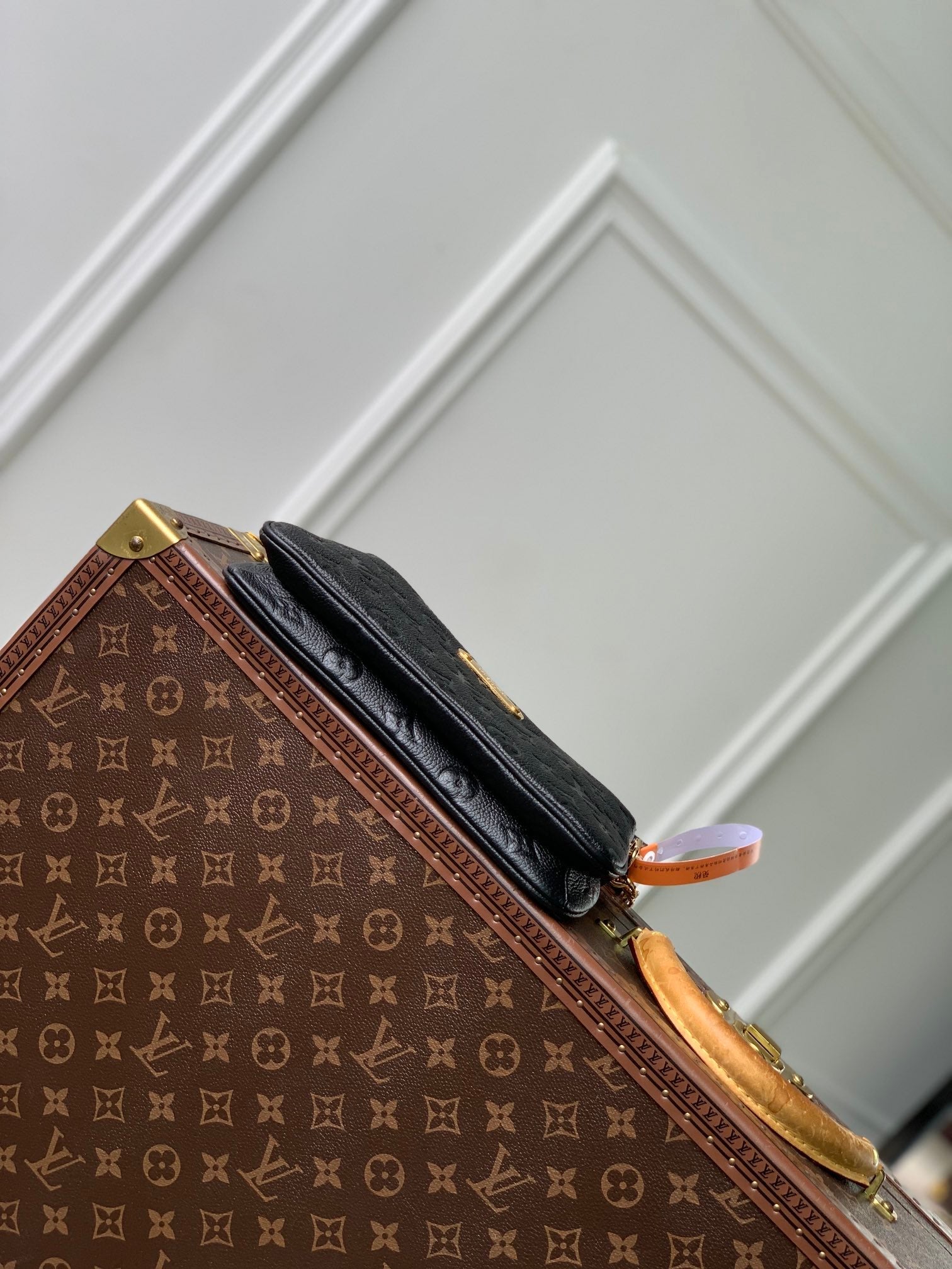 LIV POCHETTE BAG 24 IN BLACK MONOGRAM EMPREINTE LEATHER