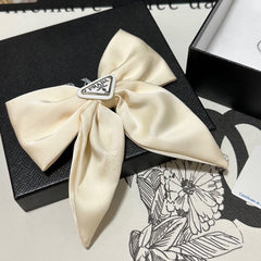 BOW-KNOT HAIR CLIP IN EGG SHELL SILK 358294