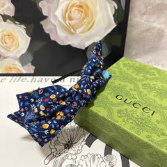 HAIRBAND IN NAVY BLUE FLORAL FABRIC 385854