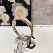 HEADBAND WITH GARNITURE PRINT IN TIGER EYE ORANGE SILK 432822