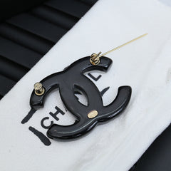 DOUBLE C BROOCH IN HAND-PAINTED ACRYLIC RESIN WITH COLORFUL STONE DESIGN