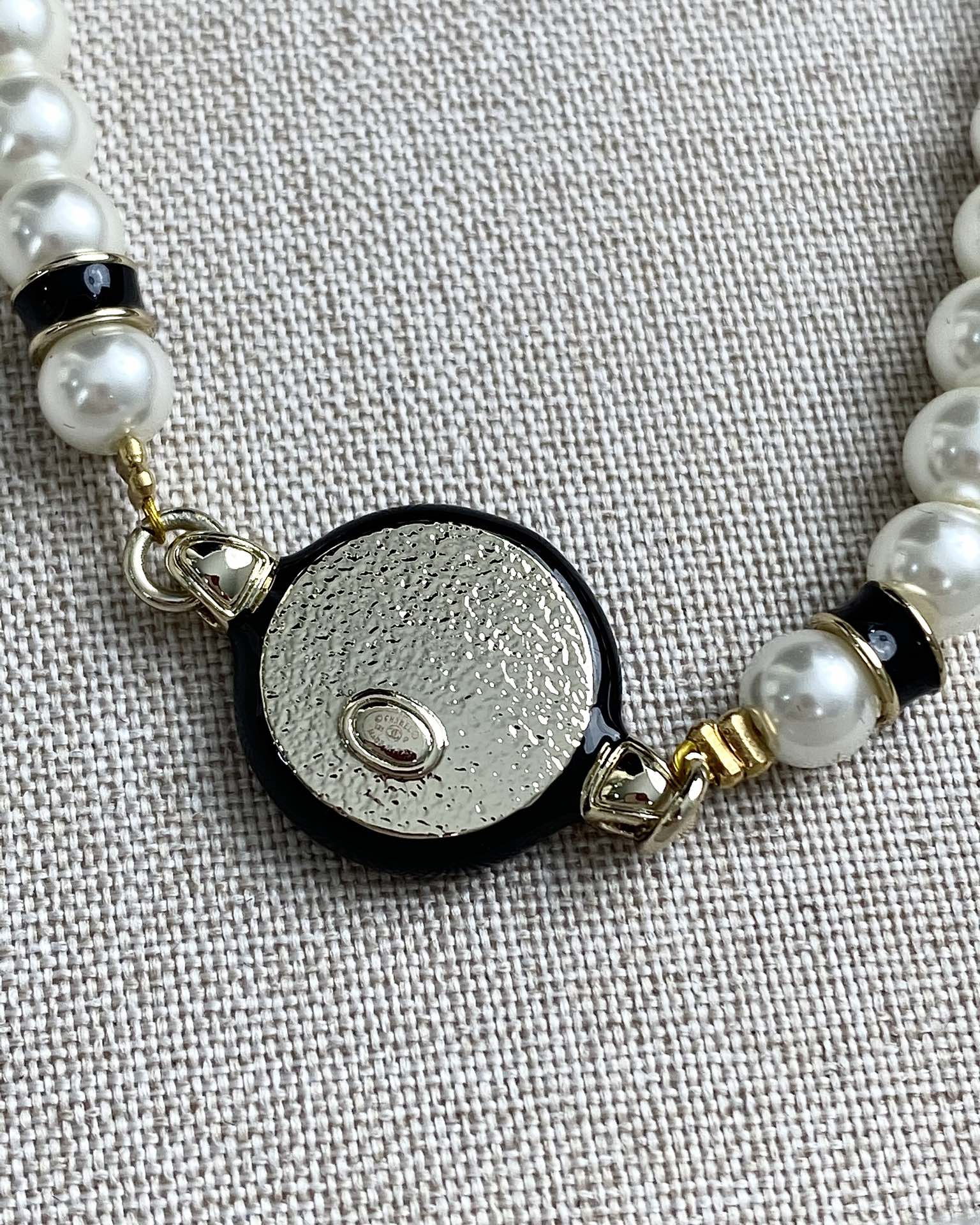 Classic CC bracelet with faux pearls and black resin.