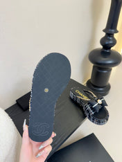 PLATFORM FLIP-FLOPS IN BLACK TWEED FABRIC