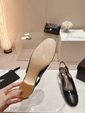 SLINGBACKS IN BLACK SHEEPSKIN