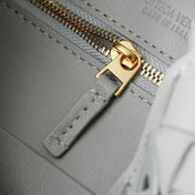 BV SMALL ANDIAMO 25CM GREY LAMBSKIN