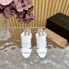 ALAIA ELASTIC CAGE MULE SANDALS IN WHITE WOVEN STRAP AND LAMBSKIN