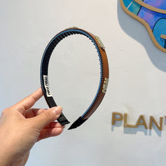 HEAD BAND IN BURNT ORANGE LAMBSKIN AND RESIN 417296