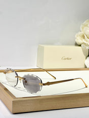 C DE RIMLESS ROUND FRAME SUNGLASSES CT0611S IN METAL