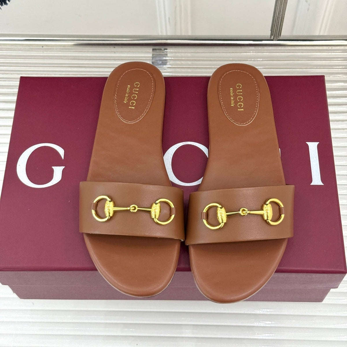 SLIDE SANDALS IN BROWN CALFSKIN WITH GOLD HARDWARE