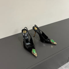 GREEN GEM-STUDDED SLINGBACK PUMPS IN BLACK PATENT CALFSKIN