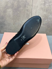 MIUMIU 26S DOUBLE STRAP MARY JANE FLATS IN BLACK SHEEPSKIN