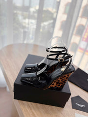 LA SCANDALE HIGH 10 CM WEDGE SANDALS IN BLACK PATENT LEATHER