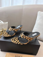 ALAIA HEELED THONG 25S 55 MM IN LEOPARD PONY HAIR LEATHER