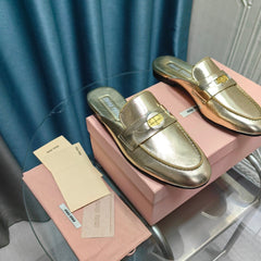 MULES SLIPPERS METALLIC GOLD COWHIDE WITH GOLD COIN