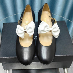 HIGH MARY JANE SHOES BLACK SHEEPSKIN WITH WHITE BOW