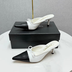 CC HEEL MULES 25S IN BLACK AND WHITE LAMBSKIN WITH BOW