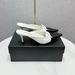 CC HEEL MULES 25S IN BLACK AND WHITE LAMBSKIN WITH BOW