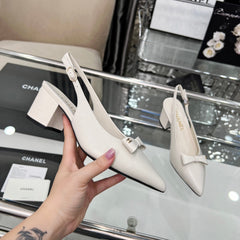 CHANEL 25S SANDALS WITH A BOW 60MM IN WHITE CALFSKIN