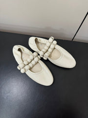ALAIA SPHERE BALLET FLATS IN WHITE LAMBSKIN