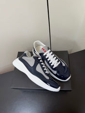 PRADA 26S SNEAKERS IN NAVY BLUE PATENT CALFSKIN AND WHITE MESH